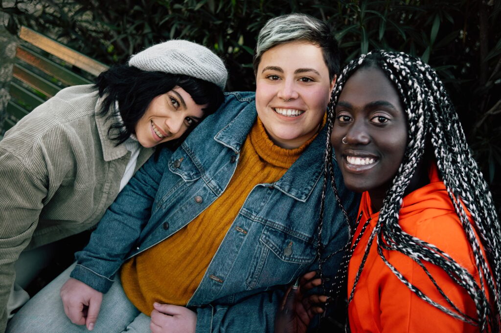 Portrait of multicultural girlfriends looking at the camera - only women concept
